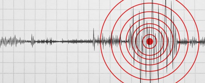 Seismograph trace across a grid with red concentric circles marking a seismic event on the right side